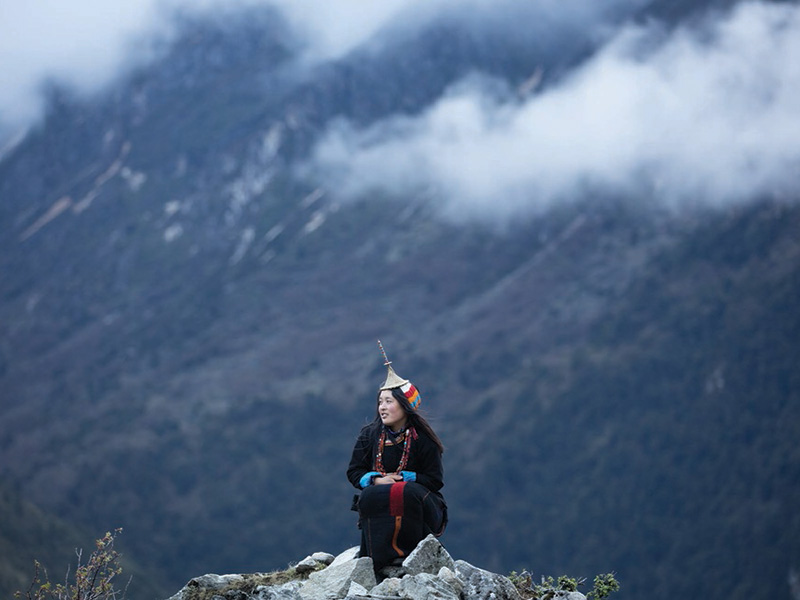 A young Bhutanese woman in traditional kira, Gasa